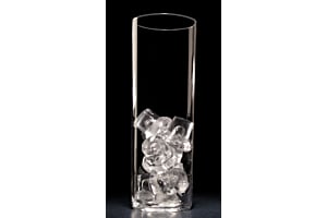 Close-up of a tall, clear glass containing Hoshizaki Crescent Ice cubes against a black background