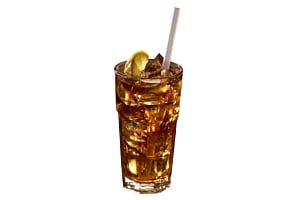 Tall glass of iced tea filled with Hoshizaki Crescent Ice, garnished with a lime wedge and a straw