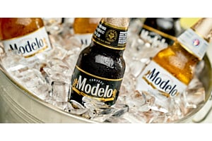 Close-up of Modelo beer bottles chilling in a bucket full of Hoshizaki Crescent Ice