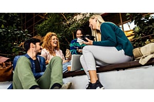 Hoshizaki equipment may have been used to prepare or store the food enjoyed by students sitting together during a campus lunch break