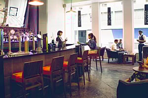 Interior view of a modern hotel bar or lounge area, featuring Hoshizaki equipment and representing the hospitality industry