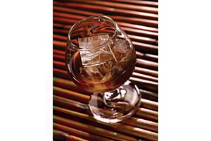 Overhead view of a glass containing a dark beverage and large, clear Hoshizaki square ice cubes