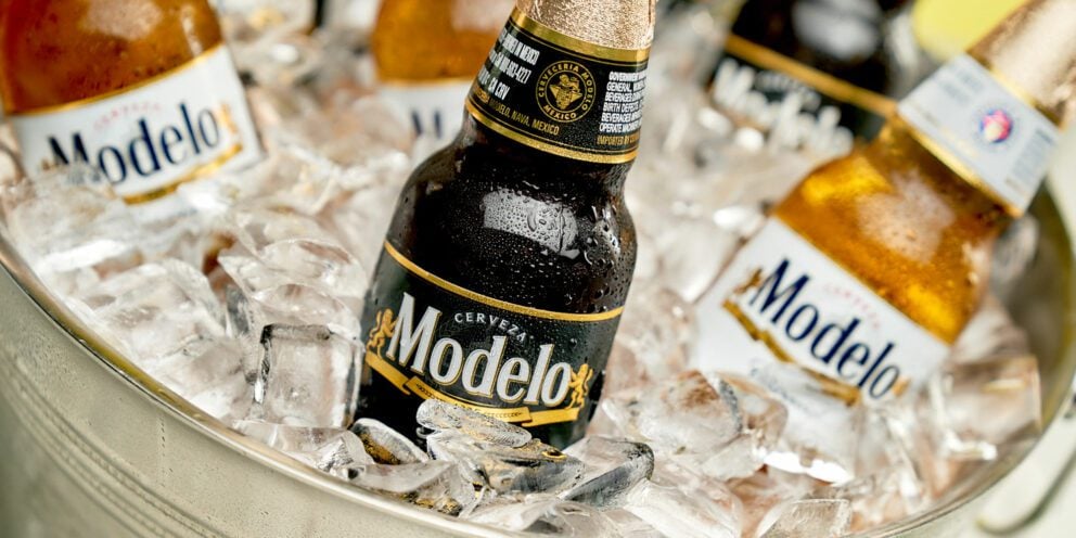 Close-up of Modelo beer bottles chilling in a bucket full of Hoshizaki Crescent Ice